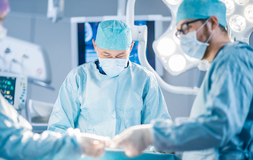 doctors performing craniotomy